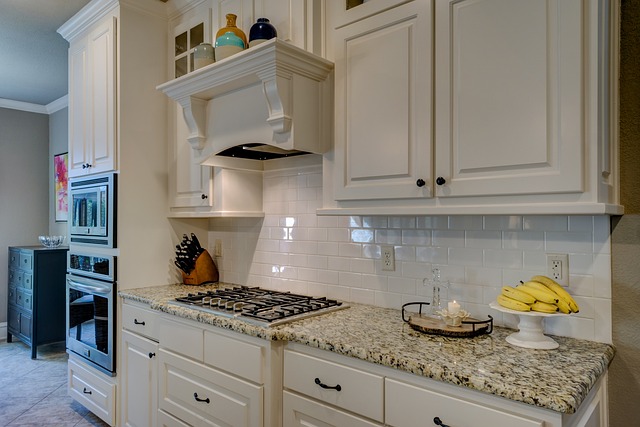 Do kitchen cabinets go in before flooring?