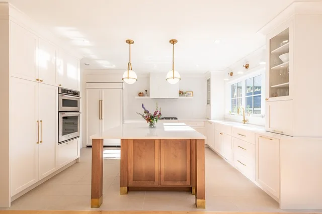 Do you have to sand kitchen cabinets before painting?