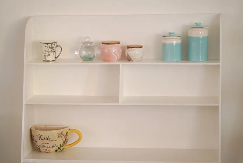 Why do kitchen cabinets have wasted space under the counter?