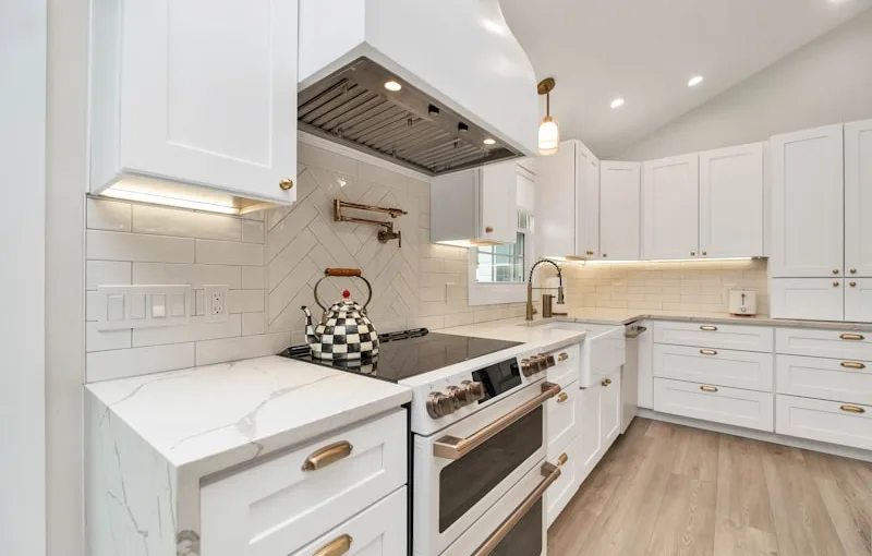 Why does the house have throw pillows stuffed above kitchen cabinets?